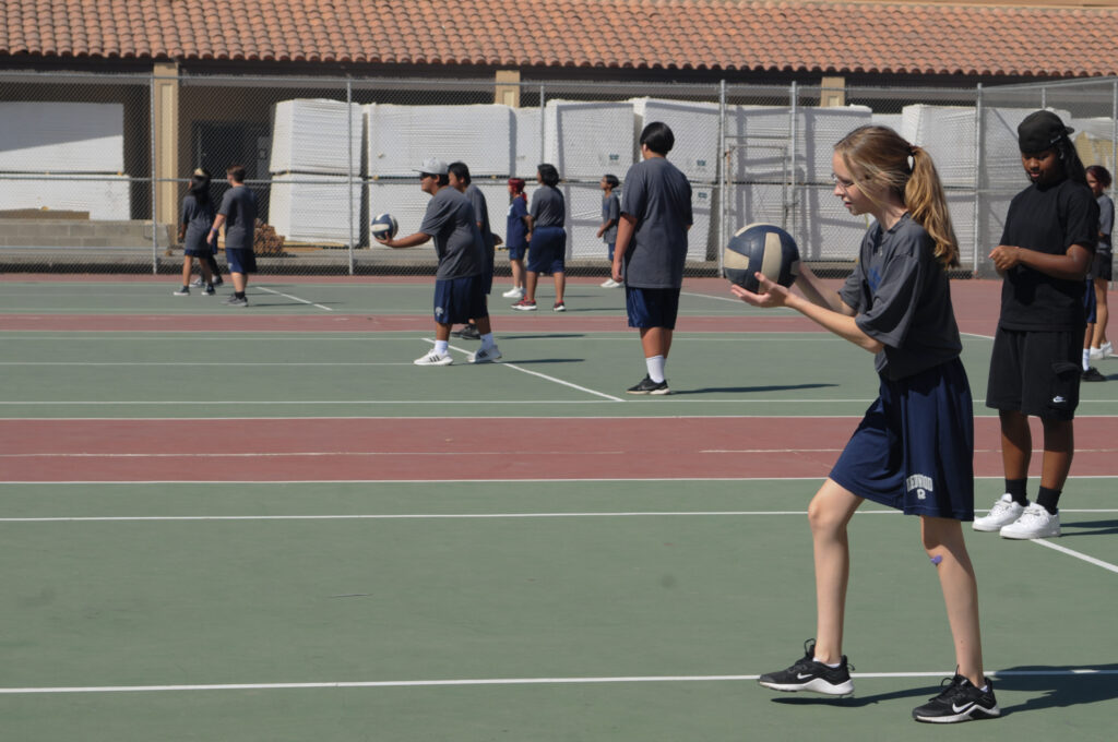 This shot is made during PE. Lots of students were playing volleyball. They were having fun and working hard as well. 