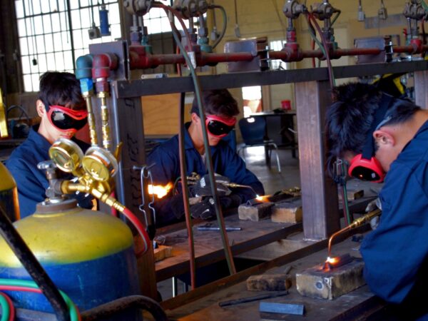 These students are welding 2 pieces of metal together.