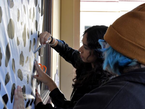 Students working hard decorating their 2nd period door for Cowhide Door Decorating Competition.