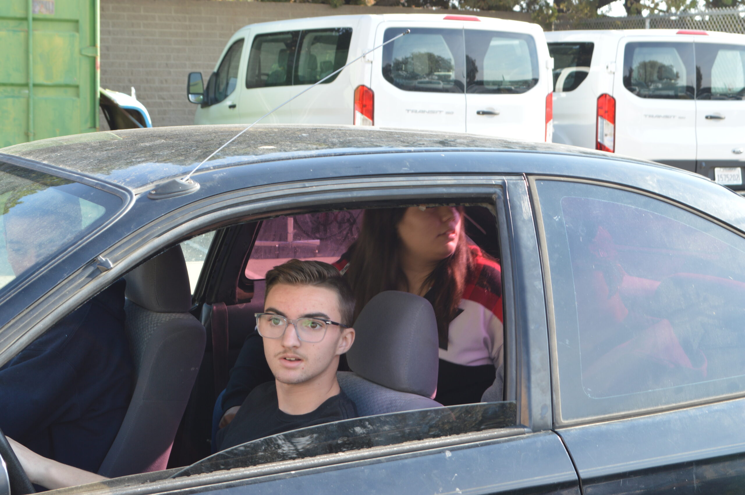 purple car with people in it