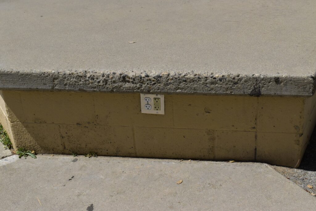 This is a concrete slab that is in the quad. The out of place thing is the outlets because why would you need outlets outside in concrete.