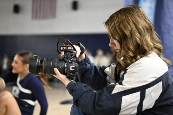 A student photographer capture the action t the rally. On Monday, November 4th, 2024 the students at Redwood assemble d to receive the Cowhide trophy following the annual Cowhide game. ©Nick Miller/Visalia Stage &amp; Field