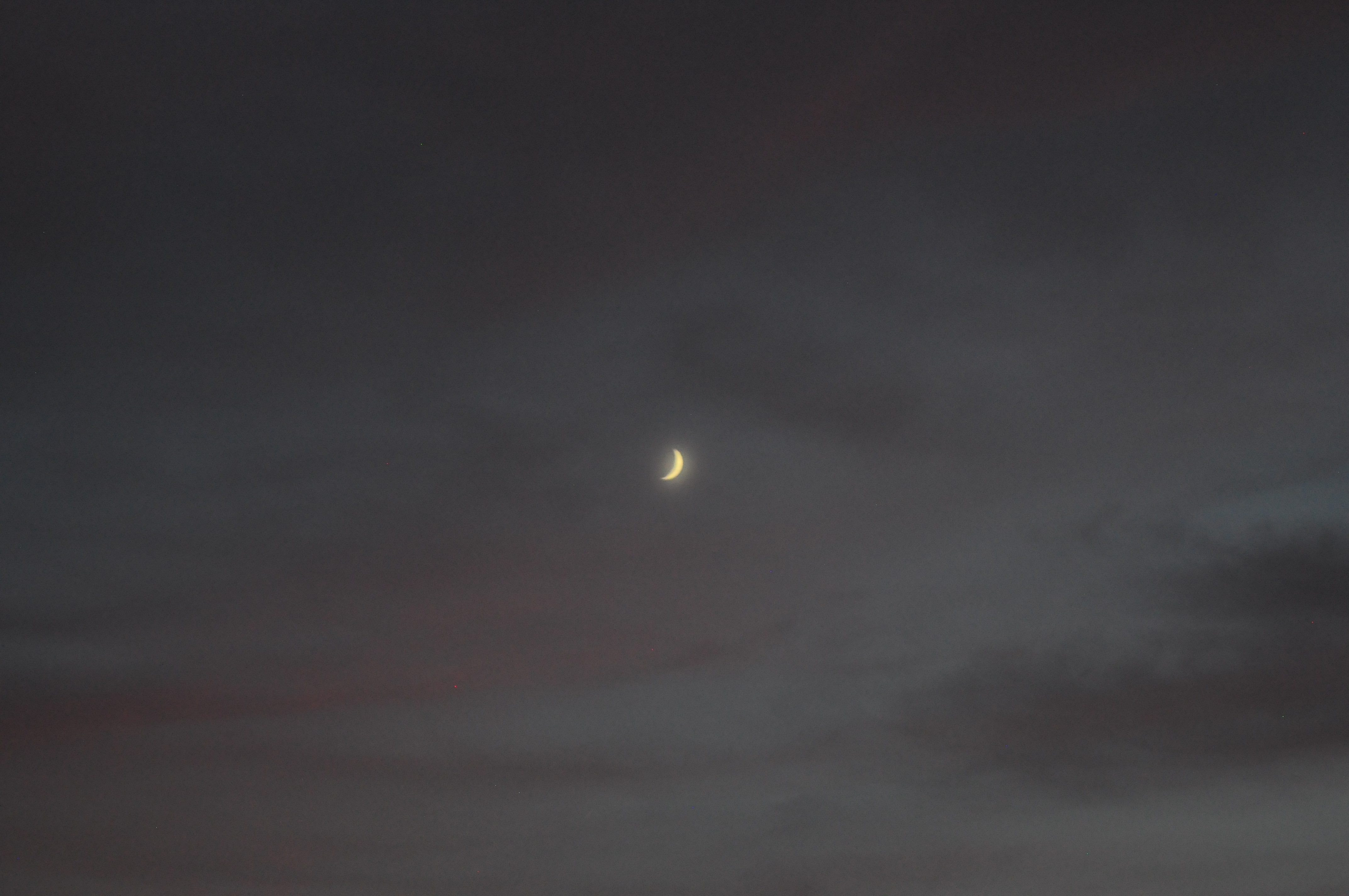 What makes this spooky is the dusky sky and nothing but the crescent moon in the middle.