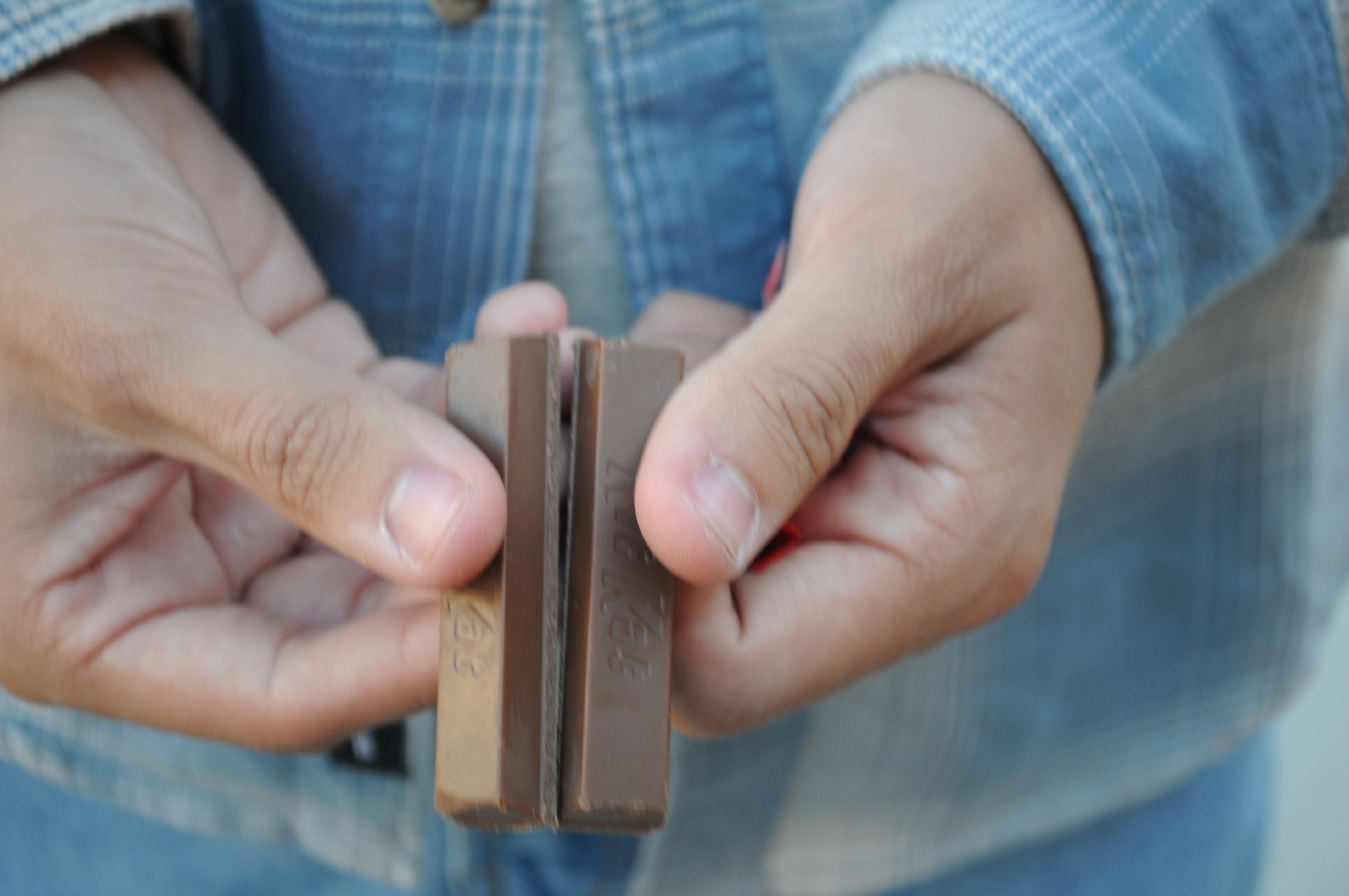 Alex breaking a kitkat